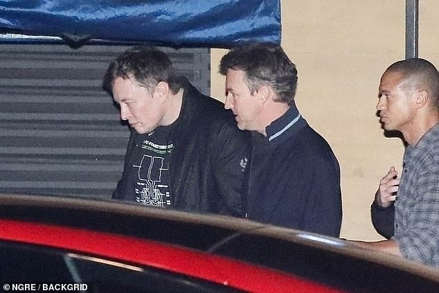 After dinner, Musk emerged from the restaurant with actor Ed Norton (center with Musk)