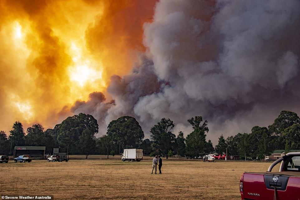 As the fire front approached, the sky was filled with orange flames and thick, grey plumes of smoke